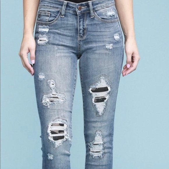 ripped jeans with camo patches